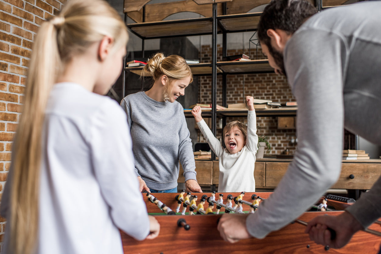 Family Playing Foosball